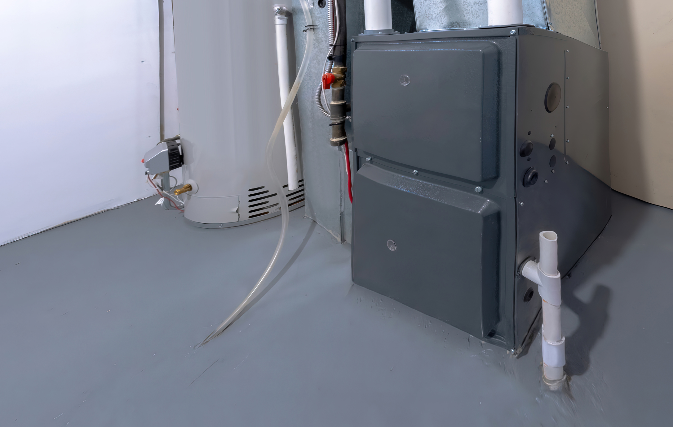 Electric furnace in a residential basement next to a water heater